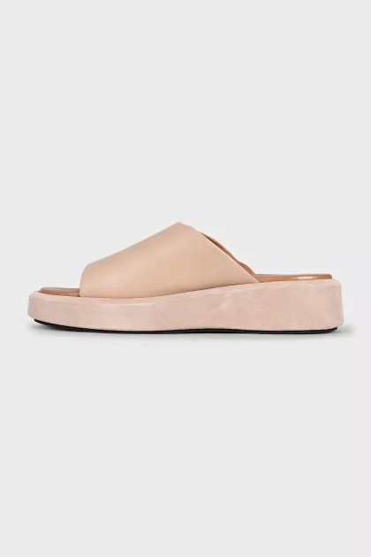 Beige leather flip-flops with high soles