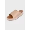 Beige leather flip-flops with high soles