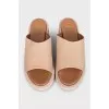 Beige leather flip-flops with high soles