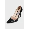 Black patent leather pumps