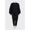 A suit consisting of a sweatshirt and tapered trousers