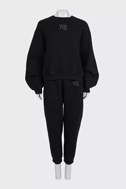 A suit consisting of a sweatshirt and tapered trousers