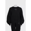 A suit consisting of a sweatshirt and tapered trousers