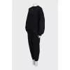 A suit consisting of a sweatshirt and tapered trousers