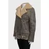 Straight sheepskin coat with a belt and zippers on the sleeves