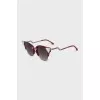 Red sunglasses decorated with crystals