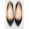 Shoes with a sharp toe on a stiletto