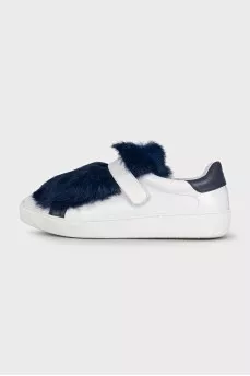 Leather sneakers decorated with blue fur