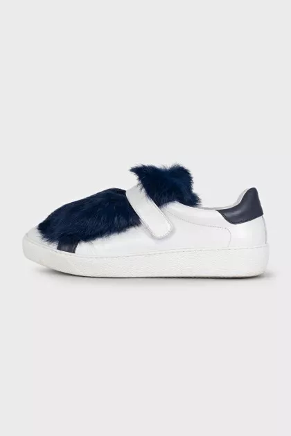 Leather sneakers decorated with blue fur