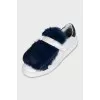 Leather sneakers decorated with blue fur