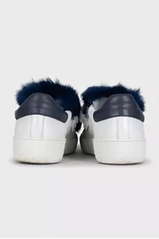 Leather sneakers decorated with blue fur
