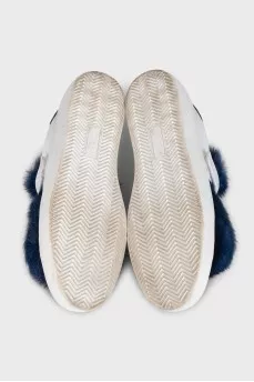 Leather sneakers decorated with blue fur