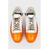 White-orange sneakers with laces