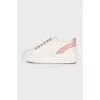 White leather sneakers with pink inserts