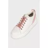 White leather sneakers with pink inserts