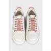 White leather sneakers with pink inserts