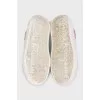 White leather sneakers with pink inserts
