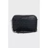 Black embossed crossbody bag