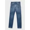 Men's blue jeans with a distressed effect