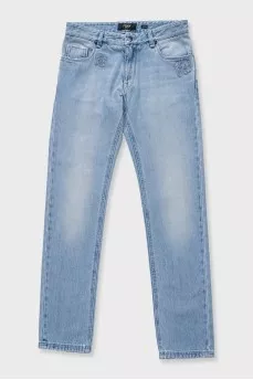 Men's light blue jeans with a patch