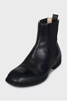 Black boots with rubber inserts