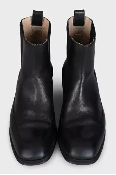 Black boots with rubber inserts