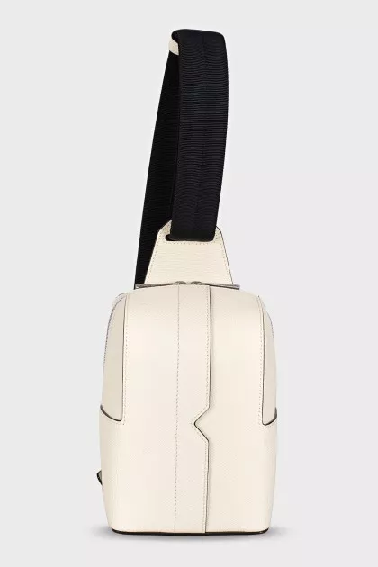 White crossbody bag with a textile strap