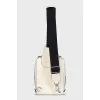 White crossbody bag with a textile strap