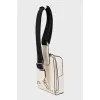 White crossbody bag with a textile strap