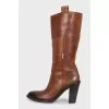 Brown boots with brand logo