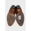 Brown boots with brand logo