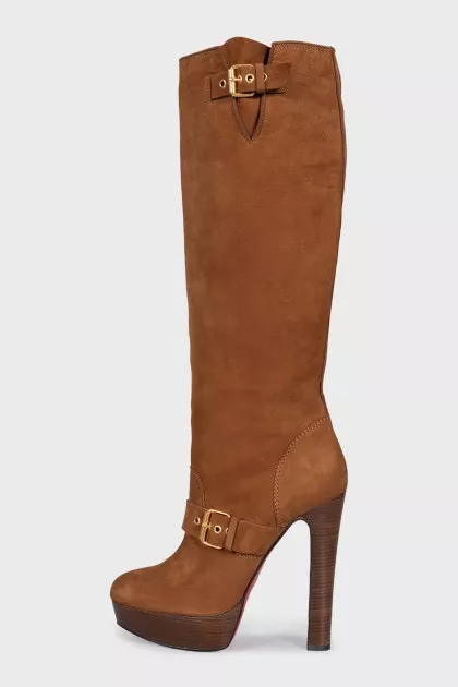 Brown suede boots with gold buckles