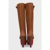 Brown suede boots with gold buckles