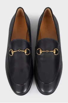 Black leather loafers with gold hardware