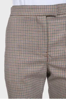 Tapered trousers in a small check with a tag