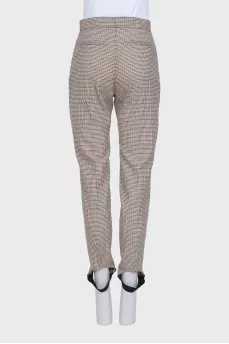 Tapered trousers in a small check with a tag
