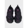 Black sneakers with contrasting Triple S logo