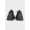 Black sneakers with contrasting Triple S logo