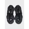 Black sneakers with contrasting Triple S logo