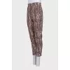 Tapered brown animal print trousers