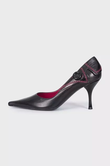 Black leather shoes with a button