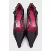 Black leather shoes with a button