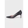Black leather pointed toe pumps