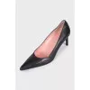 Black leather pointed toe pumps