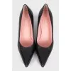 Black leather pointed toe pumps