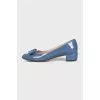 Blue patent leather shoes with a bow