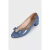 Blue patent leather shoes with a bow