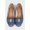 Blue patent leather shoes with a bow