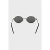 Oval sunglasses with green lenses