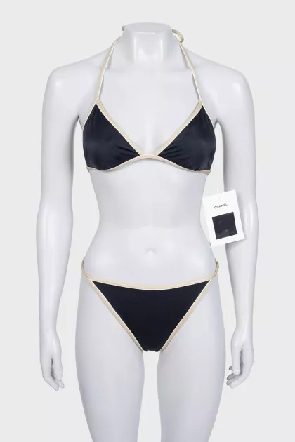 Black swimsuit with branded logo and tag